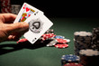 Blackjack hand of cards and casino chips