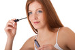 Body care series - Beautiful red hair woman applying mascara
