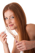 Body care series - Smiling red hair woman applying lipstick