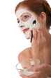 Body care series - Portrait of beautiful woman applying white fa