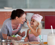 Mother and Daugther having fun together in the kitchen Mother and Daugther having fun together in the kitchen