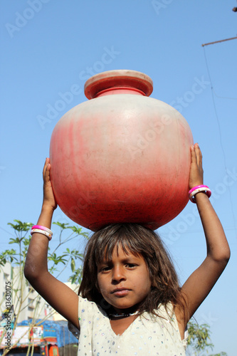 Photo: Girl Getting Water Girl Getting Water