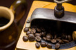 Antiquity coffee machine with beans and cup of cofe