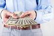 Foto: Money in the hands of the businessman Money in the hands of the businessman