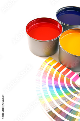 Photo: Printing press inks, cyan, magenta, yellow with color swatches Printing press inks, cyan, magenta, yellow with color swatches