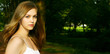 Cute young Teen Girl in a German park with dark background