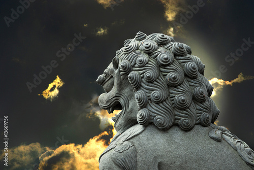 Stone lion with sky background
