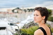 Beautiful model on the balcony  with marina background
