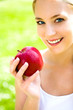 Woman holding an apple in her hand