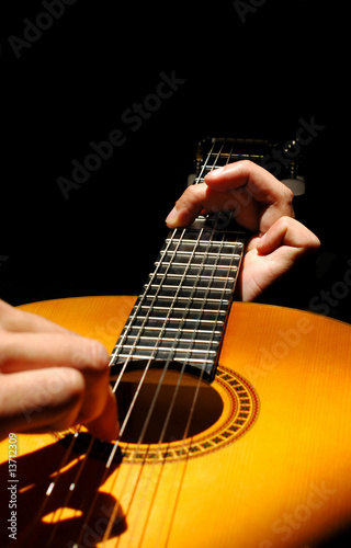 Photo: musician playing spanish style guitar musician playing spanish style guitar