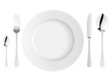 White plate with fork, knife and spoons