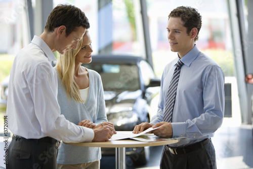 Photo: Couple buying new car Couple buying new car