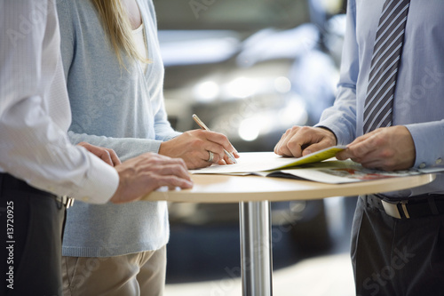 Photo: Couple buying new car Couple buying new car