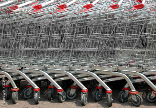 Photo: Row of supermarket shopping cart trolleys Row of supermarket shopping cart trolleys