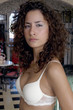 Portrait of young bride in bra, close-up, looking at camera