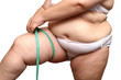 overweight woman measure her leg