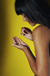 Young woman taking pills, studio shot