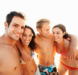 Happy group of friends at the beach