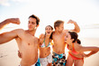 Group of teens enjoying themselves at the beach
