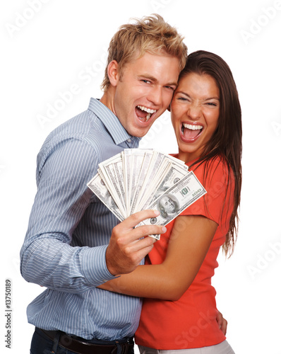 Foto: Lovely couple holding American currency notes on white Lovely couple holding American currency notes on white