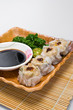 Chinese Dimsum topped with chili on top and soy sauce Chinese Dimsum topped with chili on top and soy sauce