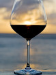 Glass of Red Wine Back Lit by the Setting Sun Glass of Red Wine Back Lit by the Setting Sun