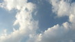 White fluffy clouds over blue sky