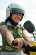 Pretty woman on bike wearing helmet