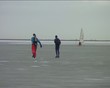 Ice sailing and skating on the Gouwzee in the Netherlands