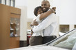 Portrait of an African American couple purchasing a car