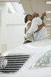 Portrait of an African American couple purchasing a car