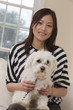 Portrait of a Chinese woman and her dog