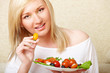 Woman eating healthy food, Greek salad
