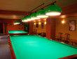 Interior of a club having billiard tables