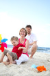 young happy family on the beach young happy family on the beach