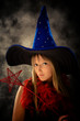 blond teenage girl with wizard hat and wand
