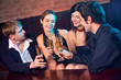 Two amorous couples celebrating together at restaurant Two amorous couples celebrating together at restaurant