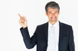 Isolated: Attractive business man pointing at copyspace