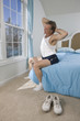 Mature man getting out of bed