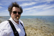 Photo: Man Smoking a Cigar on the Beach Man Smoking a Cigar on the Beach