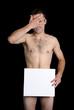 young naked man hiding behind his hand and piece of paper