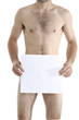 young naked man hiding behind a piece of paper