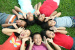 Seven children playing in the park.