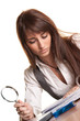 Business Searcher - Young Woman with Magnifying Glass