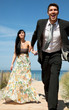 escaping honeymoon couple on the beach