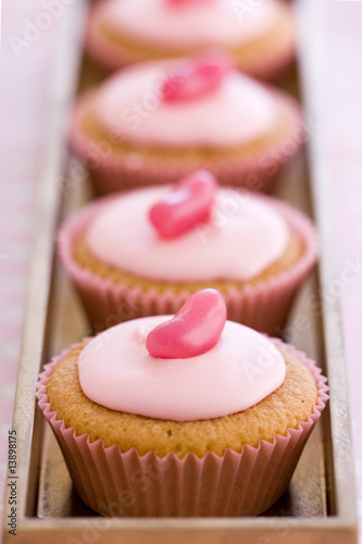 Photo: Row of pink cupcakes Row of pink cupcakes