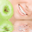 healthy teeth and green apple