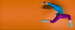 Woman leaping over orange background