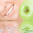 healthy teeth and green apple