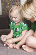 Girl playing dices with her brother